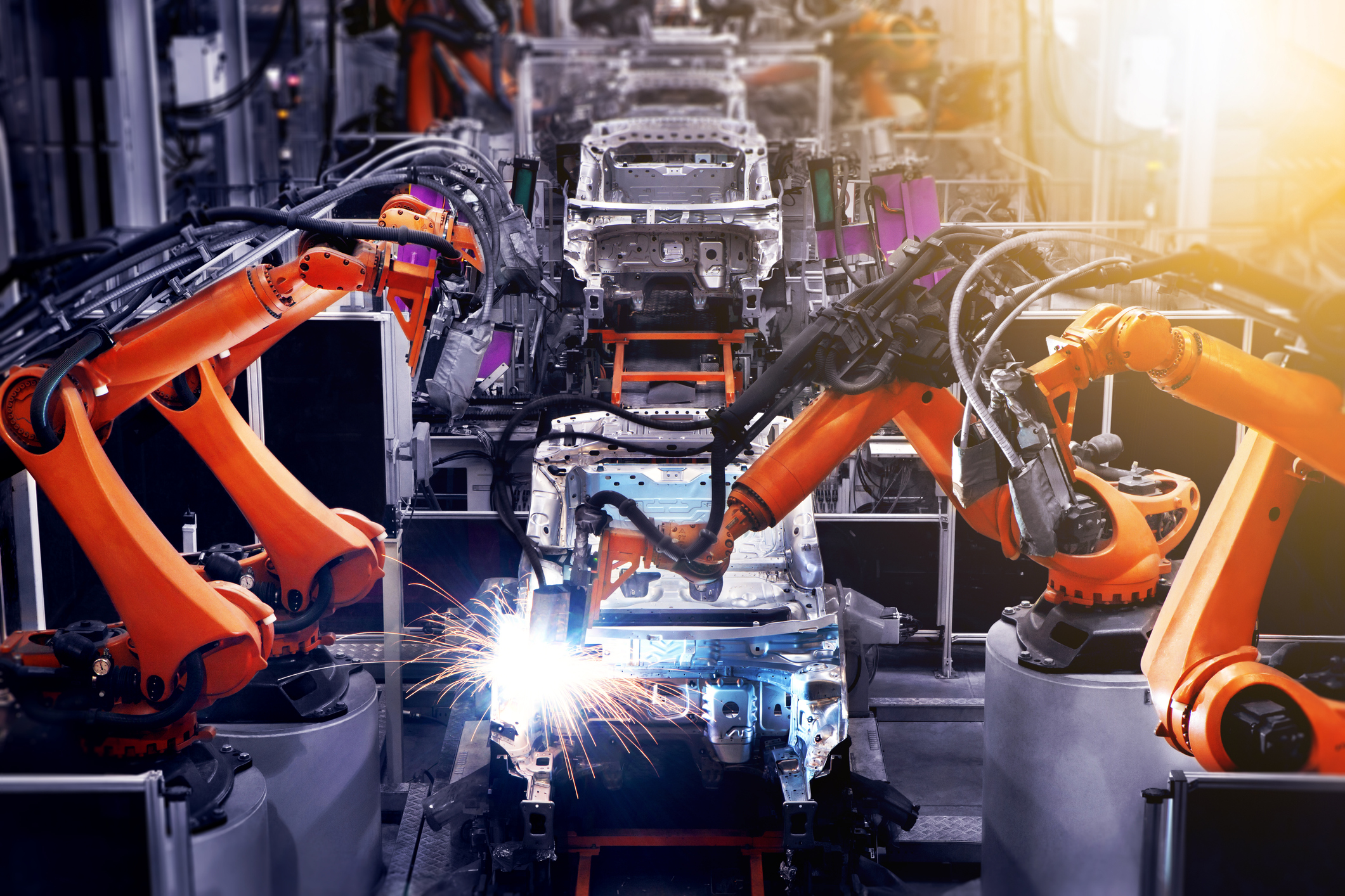 In the industrial production workshop, the robot arm of the automobile production line is working